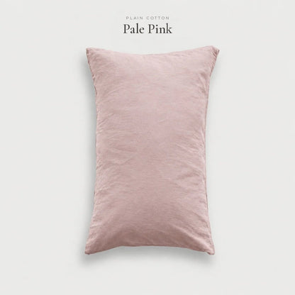 Pale Pink blush Plain Cotton pillowcase standing upright, studio shot