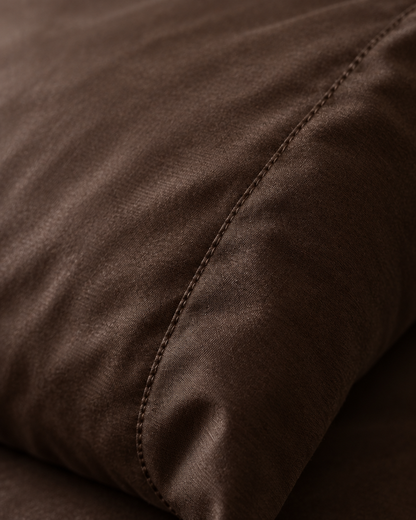 Macro of the stitched seam on a Chocolate pillow in silky cotton pillowcases.