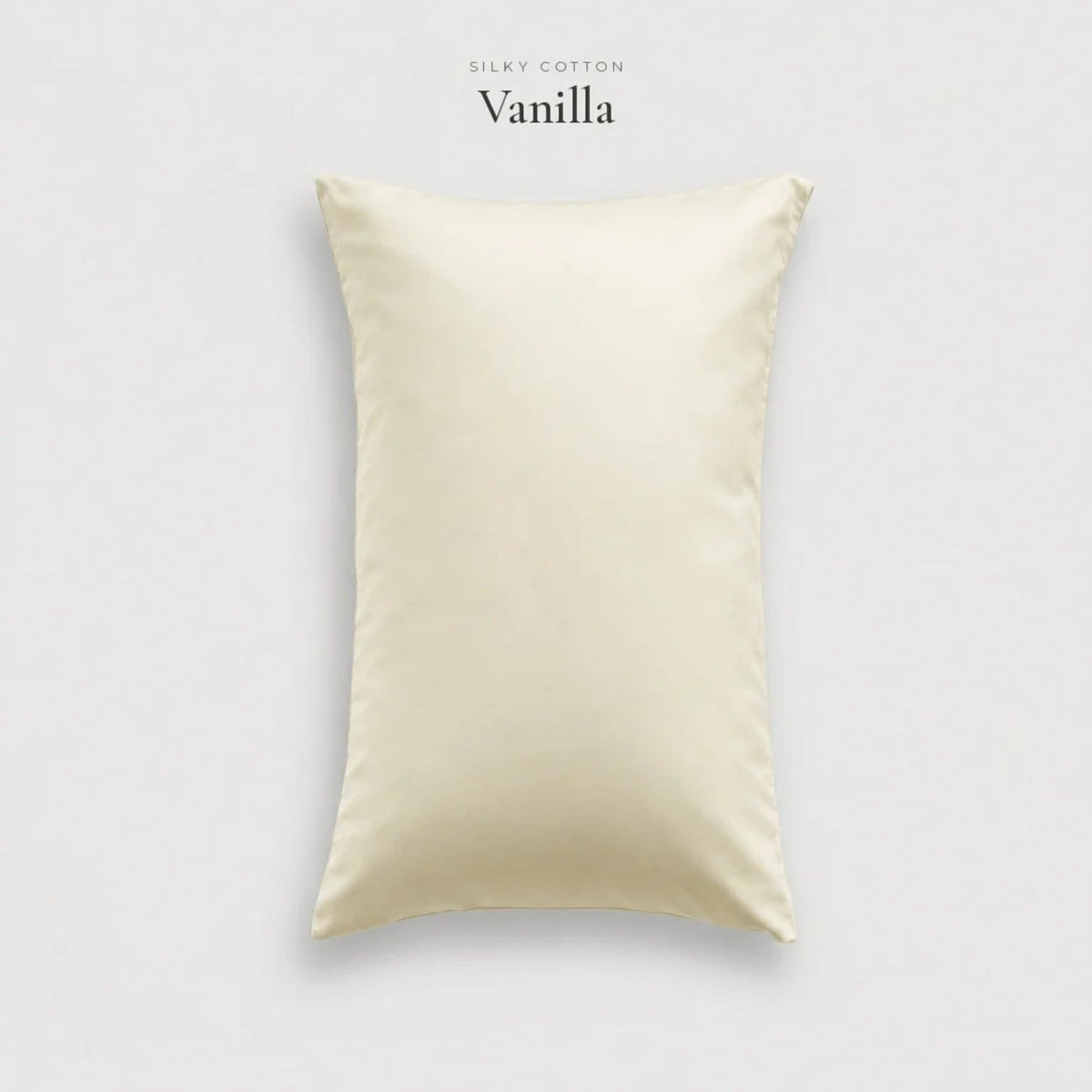 Vanilla cream Silky Cotton sateen pillowcase, studio shot on pale grey
