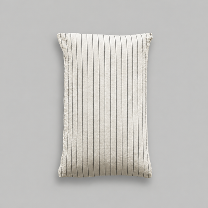 Single cloud cotton pillowcase with crisp Black Pinstripe on off-white crinkled muslin, studio shot.
