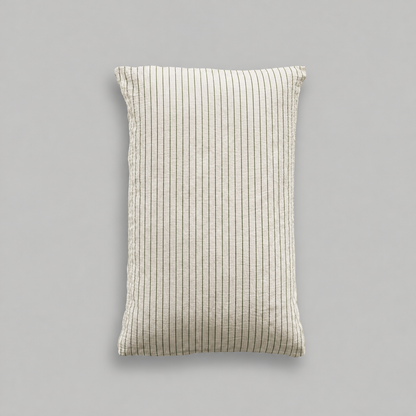 Single cloud cotton pillowcase in off-white crinkled muslin with fine Green Pinstripe on a grey studio background.