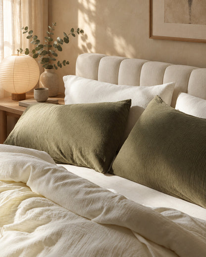 Olive green cloud cotton pillows, styled in a serene Japandi bedroom
