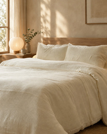 Cream cloud cotton pillows and duvet, styled in a serene Japandi bedroom