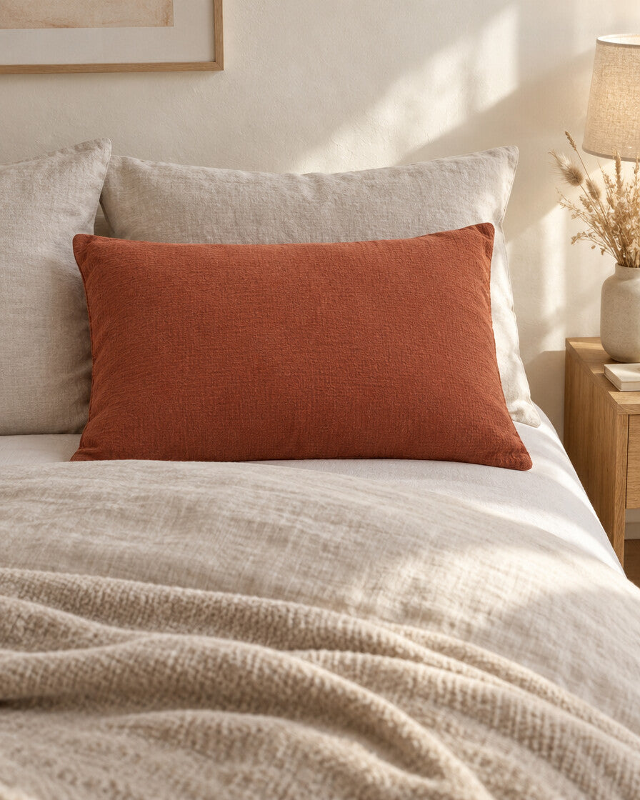 Copper cloud cotton pillowcase, styled in a calm sunlit Scandinavian bedroom