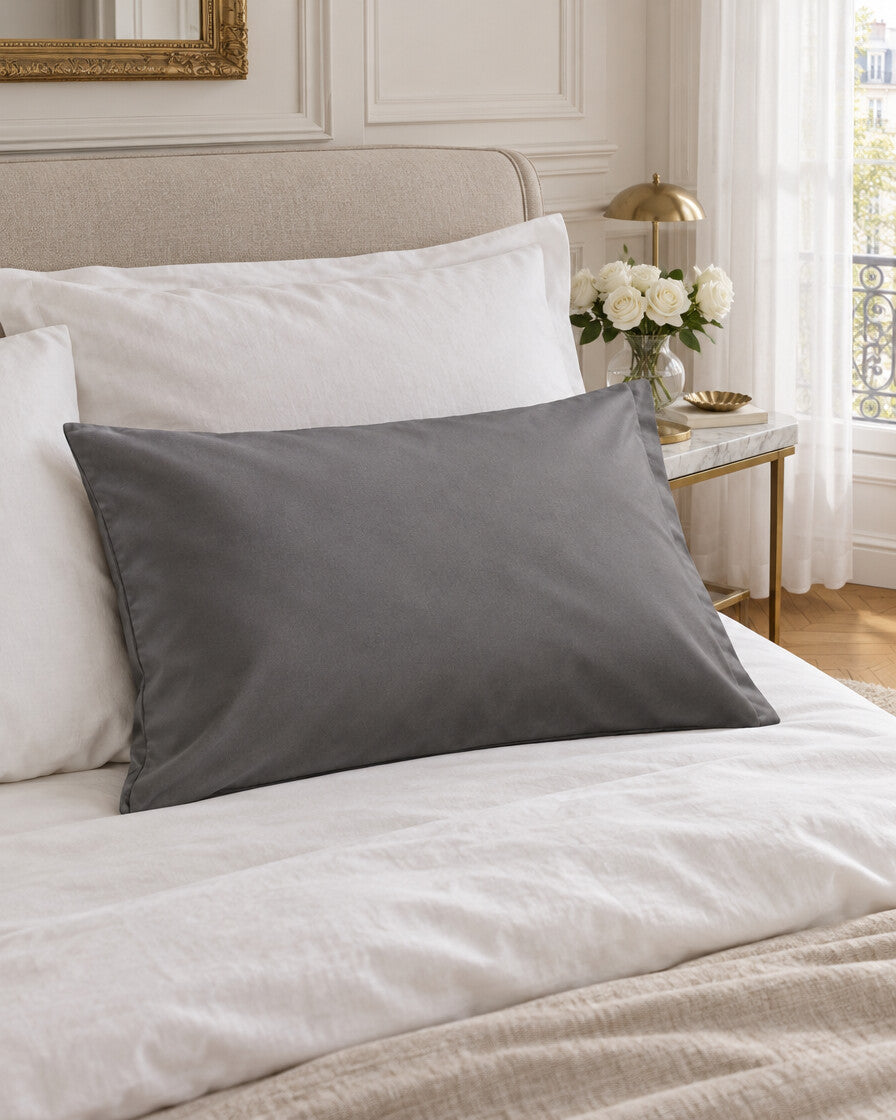 Single grey silky cotton pillowcase, styled in an elegant Parisian apartment bedroom