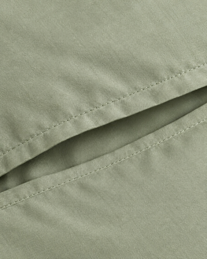 Close-up of stitched envelope opening hem of the pillowcase in Mint Green Silky Cotton