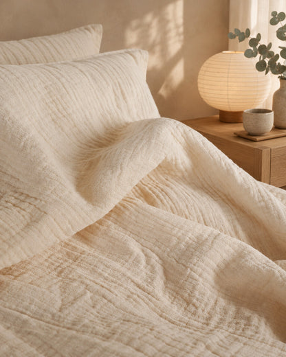 Cream pinstripe cloud cotton fabric, close view, styled in a serene Japandi bedroom