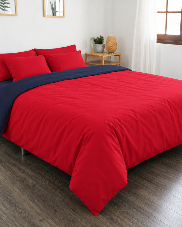 Red duvet cover with navy blue reverse, navy blue fitted sheet and red pillowcases in Plain Cotton