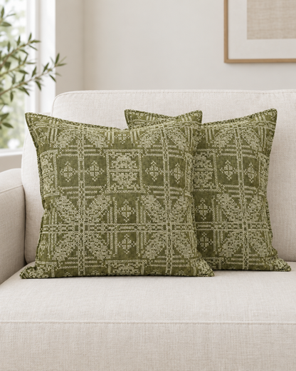 Two olive Geometric Jacquard Linen Cotton cushion covers on a cream linen sofa