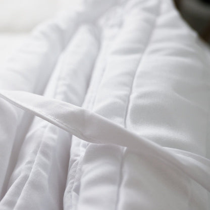Close view of the duvet insert's box stitching and corner tab.