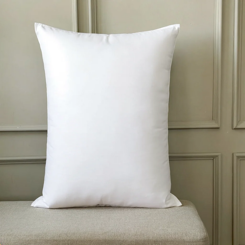 White cushion insert propped upright on a bench.