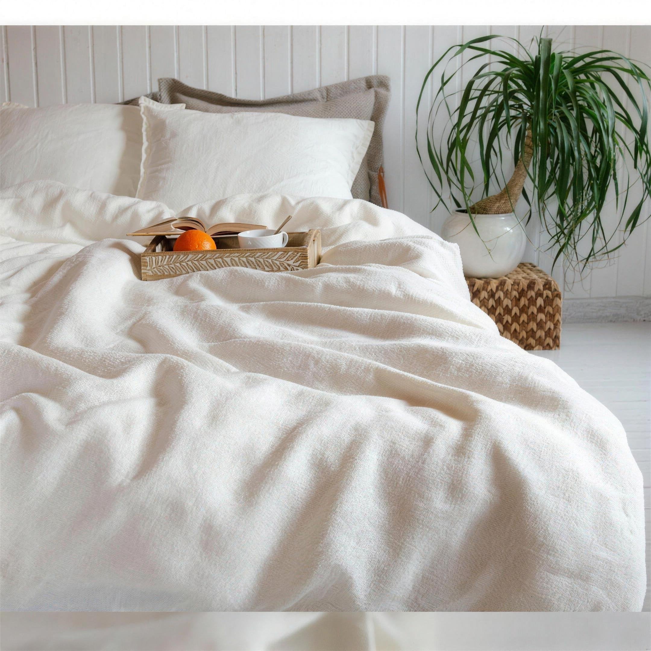 A bed made up in Snow white stonewashed French linen
