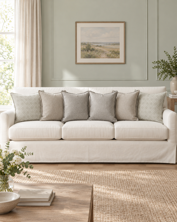 White sofa with mint grey lattice, stone flanged and silver grey flecked cushions
