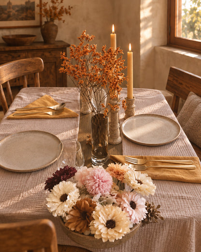 Cloud cotton table cloth, laid for dinner in a warm rustic dining room