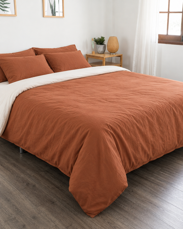 Terracotta duvet cover with off white reverse, off white fitted sheet and terracotta pillowcases in Plain Cotton