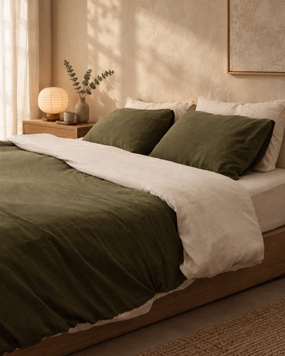 Two-tone cloud cotton bedding in olive green and cream, styled in a serene Japandi bedroom