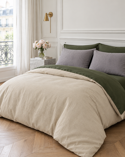 Forest Green / Beige two-tone plain cotton bedding with grey pillows in a panelled Parisian bedroom with peonies.