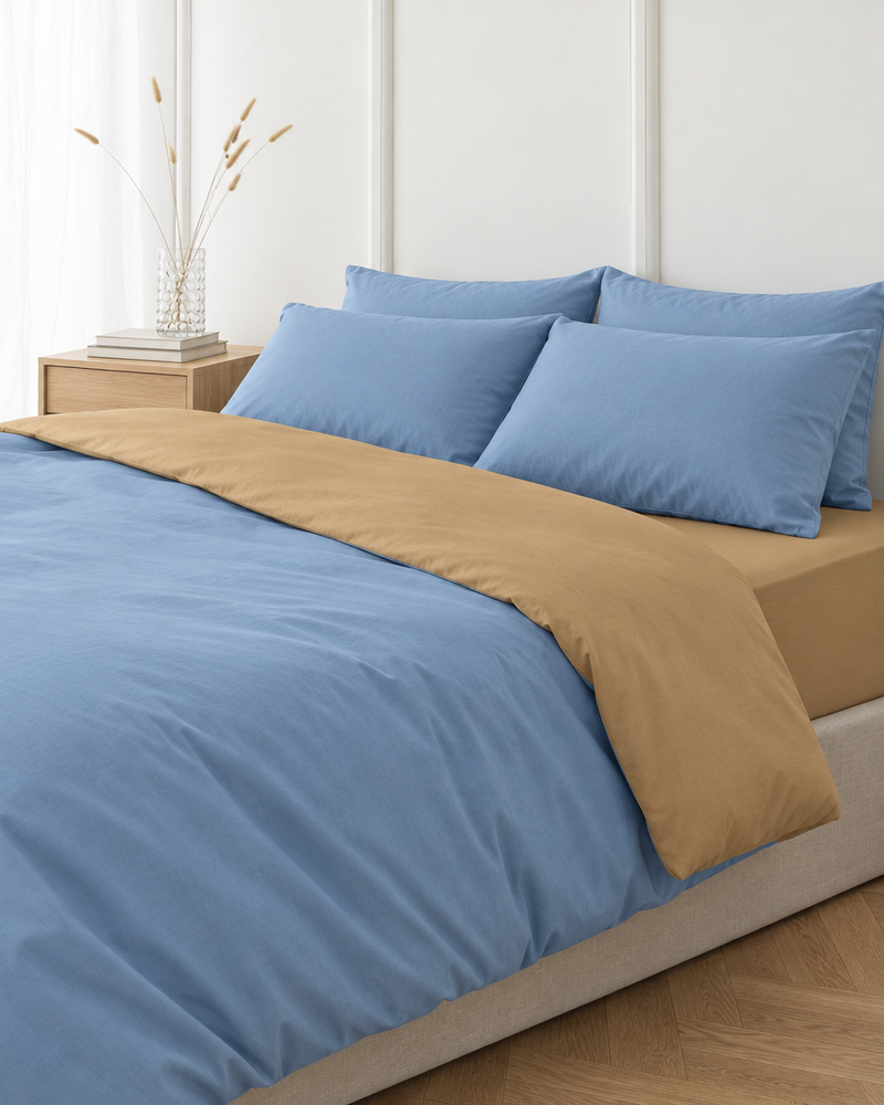 Sky blue two tone Plain Cotton duvet cover folded back to show a sand reverse